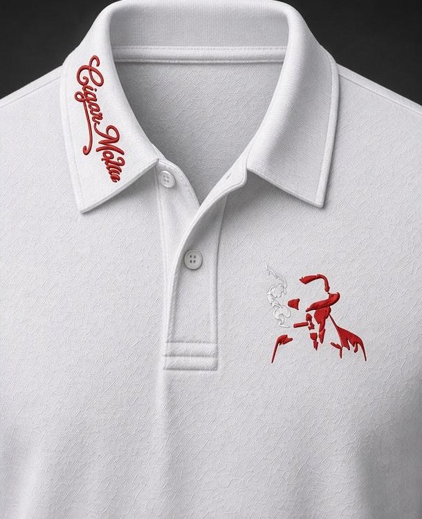 White dri-fit polo, red script collar embroidery, red embroidered smoking-man-in-fedora silhouette on the chest