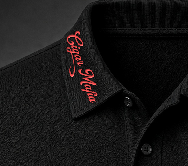 Cigar Mafia Club Polo collar detail, red Cigar Mafia script along one collar point, embroidered on black collar