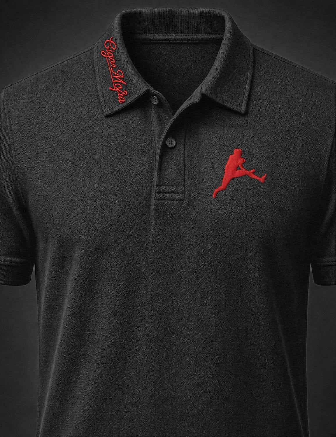 Black dri-fit polo, red script embroidery on one collar point, red embroidered leaping silhouette on the chest