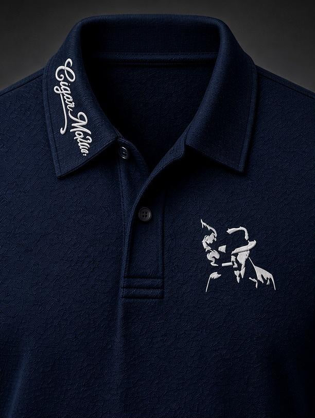 Navy dri-fit polo, white script collar embroidery, white embroidered smoking-man-in-fedora silhouette on the chest